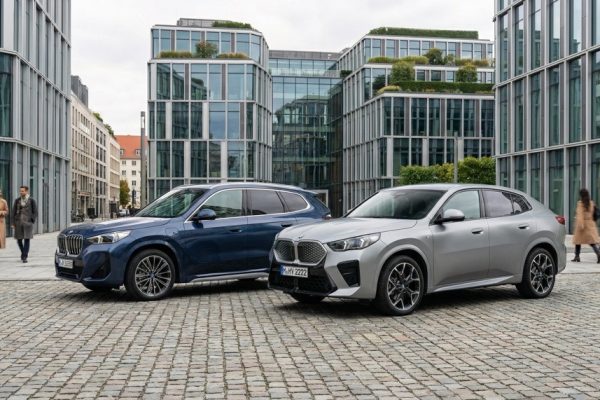 BMW iX1 and BMW iX2 electric SUVs in urban environment