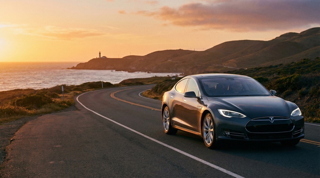 Tesla driving on open road symbolizing long-term battery durability and low ownership risk