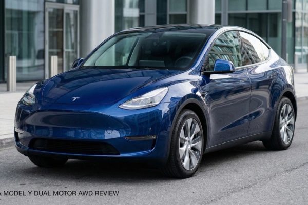 Front three-quarter exterior view of Tesla Model Y all-wheel drive version parked outdoors